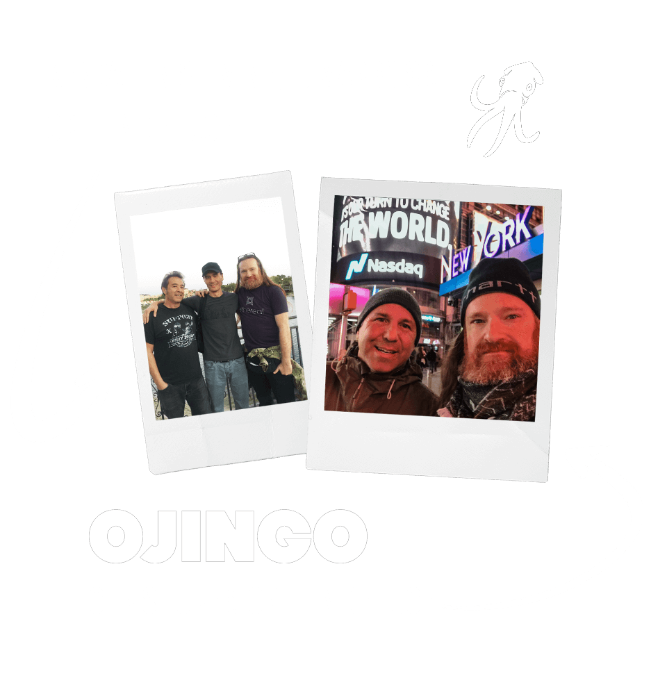 2 Polaroids photos: 1) Ojingo partners Kendall Nishimine, TJ Marboise, and Griffin de Luce; 2) Longtime business partners Chris Fure and Griffin de Luce in Times Square (NASDAQ sign reads "It's Our Turn to Change The World")